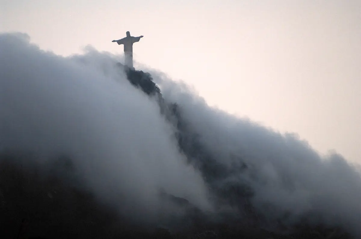 Clouds rolling over Corcovado below the statue