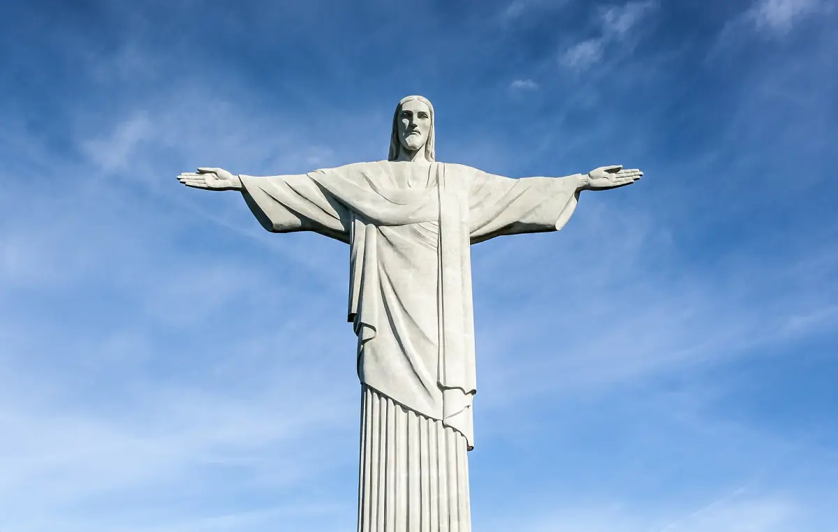 The statue of Christ the Redeemer against a blue sky