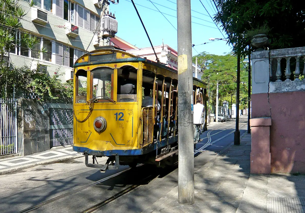 The yellow Santa Teresa tram in a street of the neighbourhood